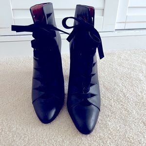 Beautiful black leather booties with suede laces. Perfect for date night!